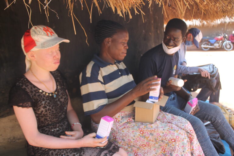 Motorbike mission: Activist delivers sunscreen to Ugandans with albinism