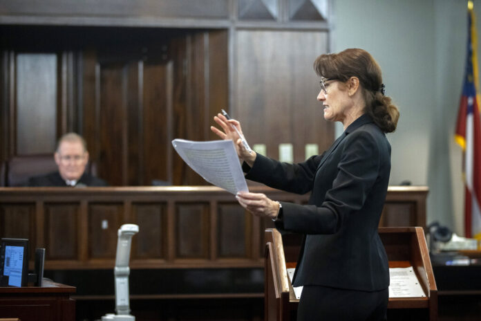 Prosecutor Linda Dunikoski stands in the courtroom during the trial of the murder of Ahmaud Arbery