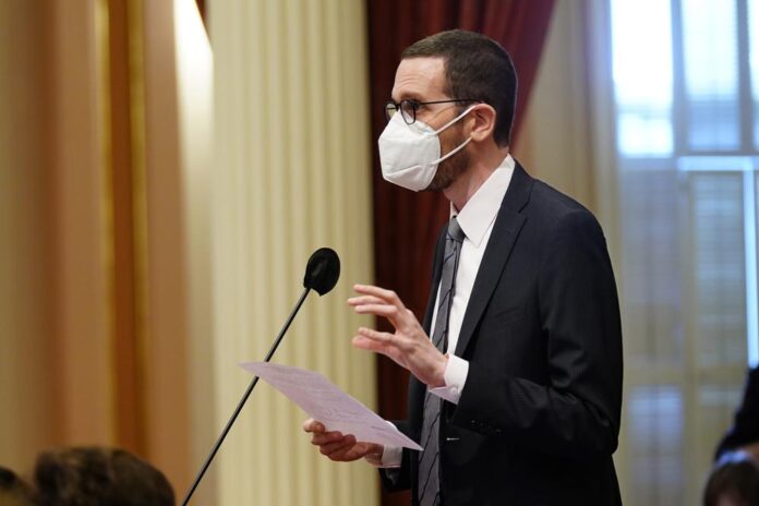 Man Wearing Mask Giving Speech On The Stage