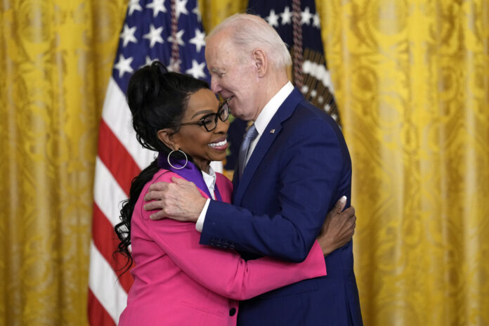 President Joe Biden Hugging a lady