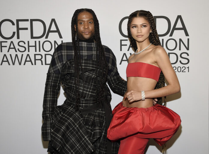 Law Roach left, and Zendaya attends the CFDA Fashion Awards