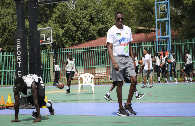 Masai Ujiri walks onto the basketball court