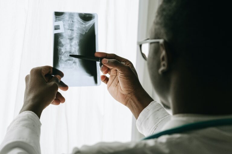 A doctor checking the X ray of a patient